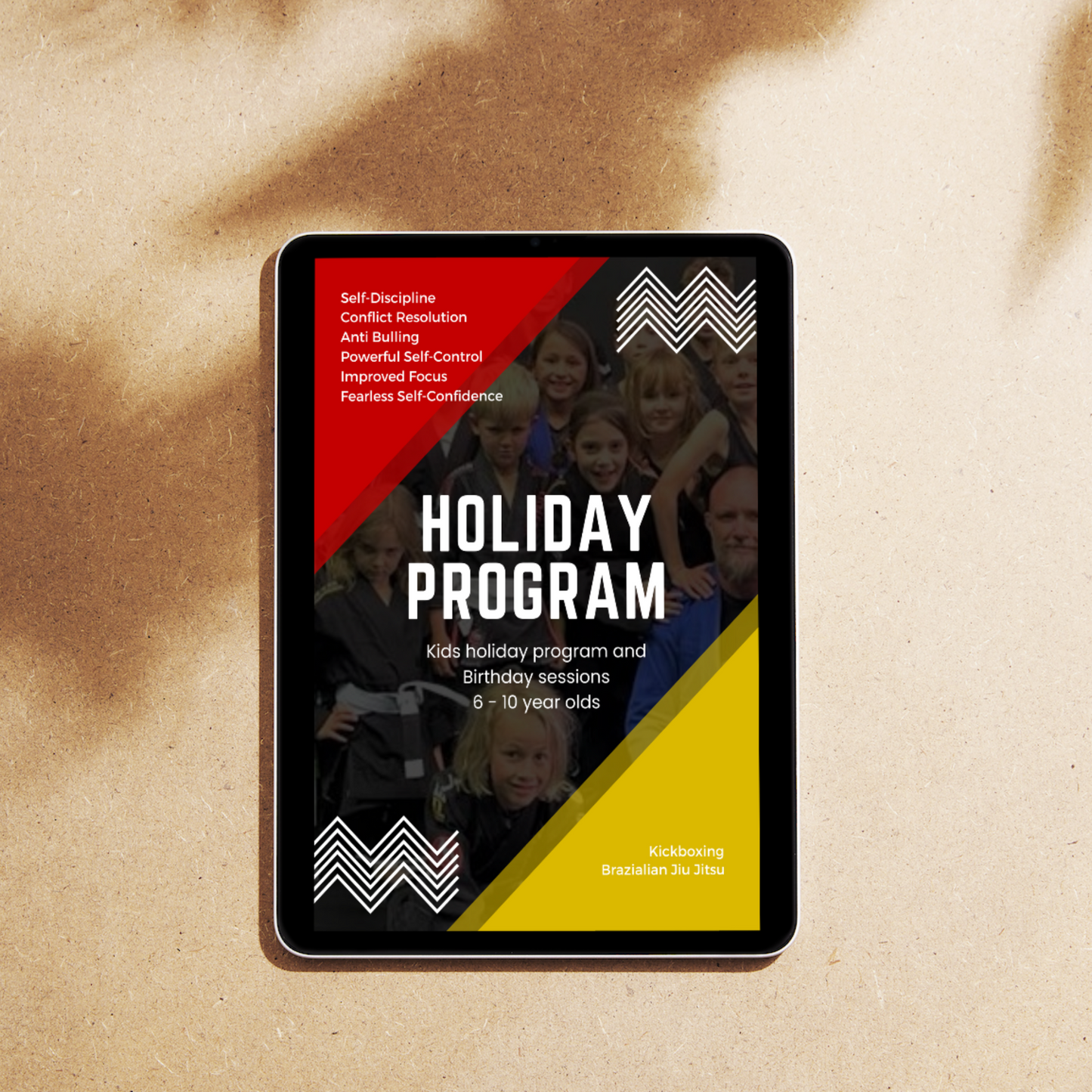 Tablet displaying Martial Arts Holiday Program poster for kids aged 6-10, featuring kickboxing and BJJ classes.