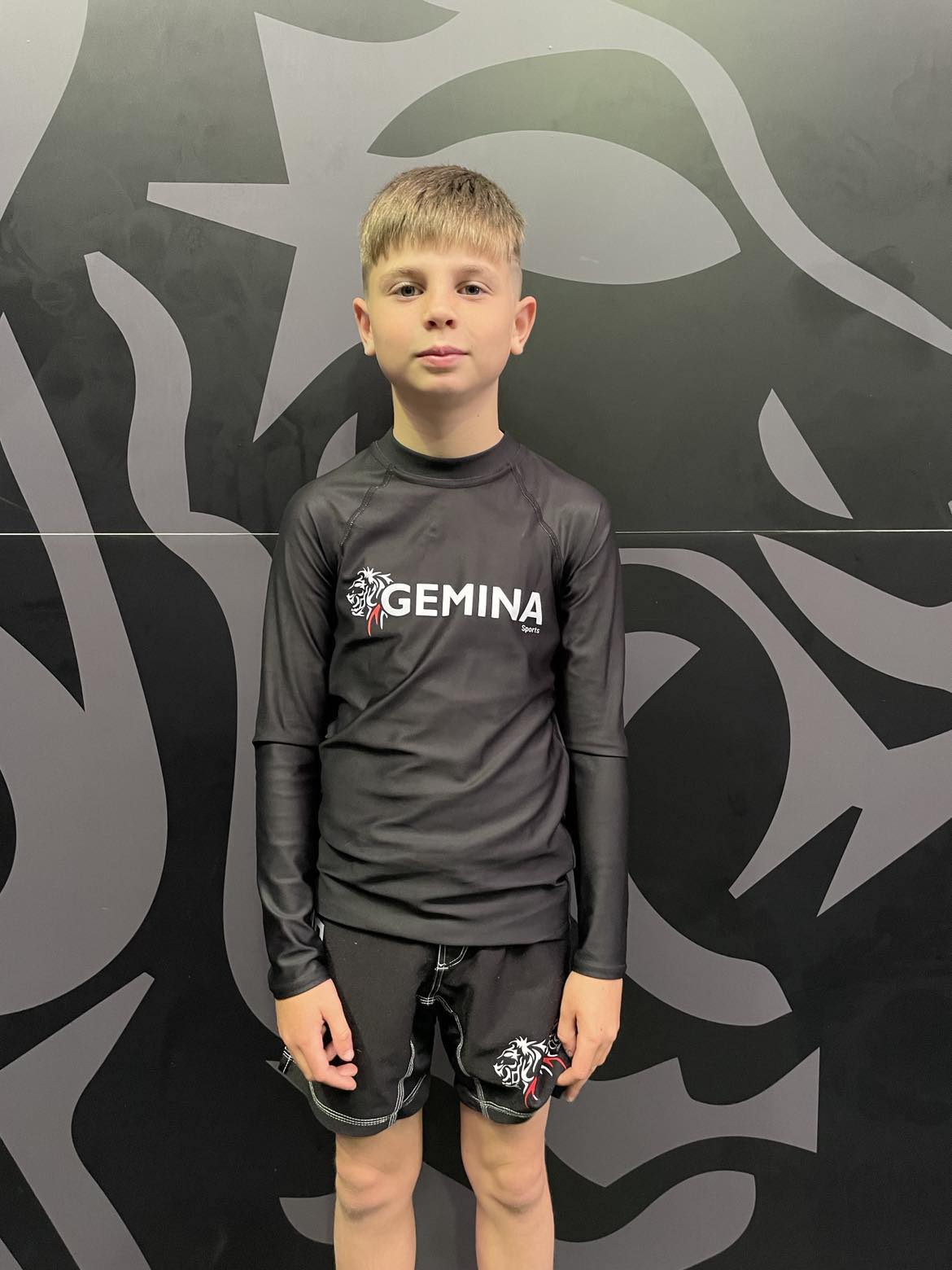 Soft and fitted Gemina Youth Rash Guard for active teens, with UPF 50+ protection and durable stretch fabric.