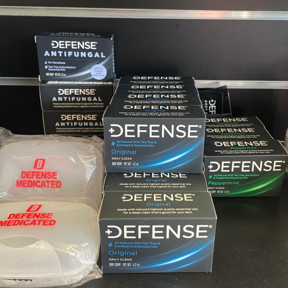 Defense Soap products displayed on a shelf, including antifungal and medicated varieties.
