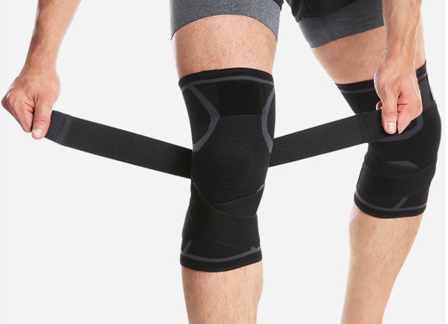 Coolfit Knee Brace with adjustable X-strap for support and compression, promoting pain relief and faster recovery.